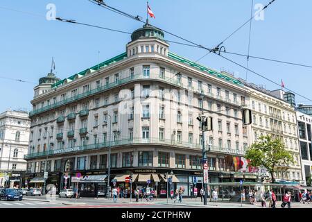 Vienna, Austria – June 3, 2017. Exterior view of Hotel Bristol on Karntner Ring  street in Vienna, Austria, with people, commercial properties and tra Stock Photo