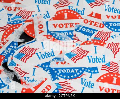 Concept for the end of the election in the USA with torn and scratched campaign buttons on glass Stock Photo