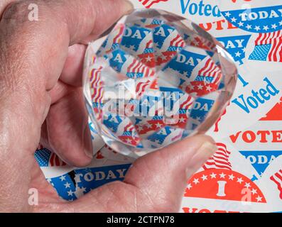 Concept for the confusion in the result of the USA election as campaign buttons are reflected in confused pattern in prism Stock Photo