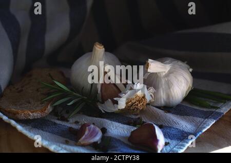 garlic black bread rosemary on a towel Stock Photo