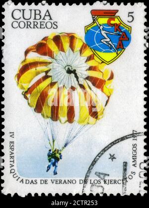 Saint Petersburg, Russia - May 31, 2020: Stamp printed in the Cuba the image of the Parachuting, circa 1977 Stock Photo