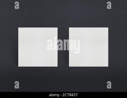 Blank white Business card mockup stacks at grey textured paper background. Stock Photo