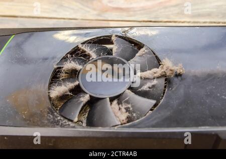 Dusty video card from a computer close up on a wooden background Stock Photo