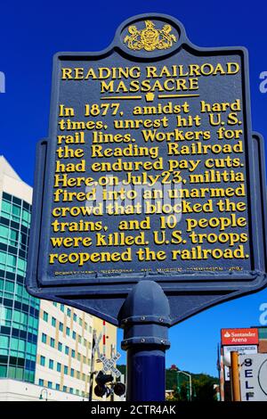 Reading, PA, USA - September 19, 2020: An historical marker sign noting the Reading Railroad Massacre is located in downtown Reading, Berks County, PA Stock Photo