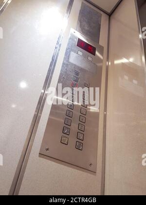 5 floor up, elevator buttons, close-up Stock Photo