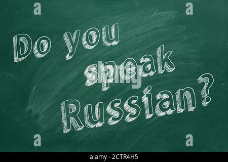 Hand drawing 'Do you speak Russian?' on green chalkboard Stock Photo