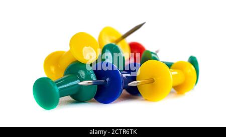 Closeup of Many Colored Thumbtacks on White Stock Photo