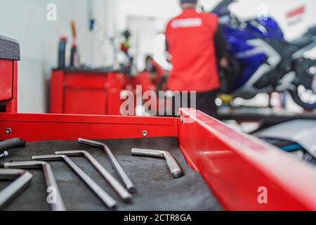 Motorcycle mechanics workshop, professional tools, selective focus. Stock Photo
