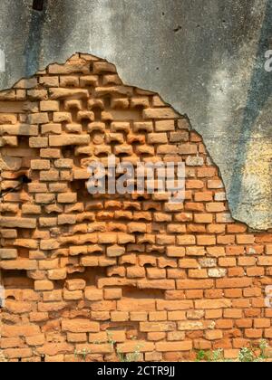 Old damaged abandoned brick wall Stock Photo