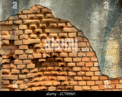 Old damaged abandoned brick wall Stock Photo