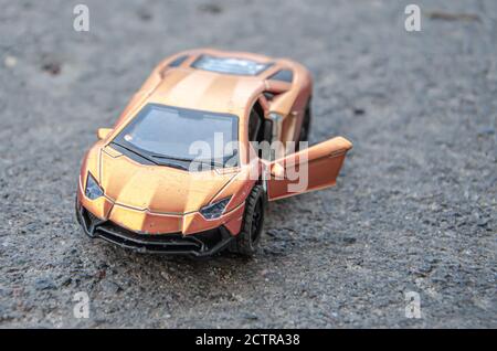 miniature colorful cars standing in line on road sale concept. Stock Photo