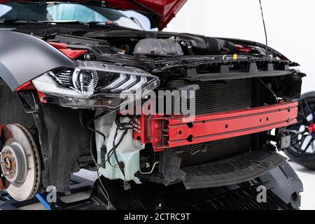 Broken incomplete sports car in car service Stock Photo - Alamy