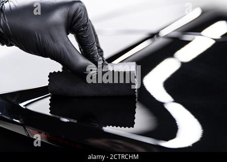 Car Service Worker Applying Nano Coating On A Car Detail. Stock Photo,  Picture and Royalty Free Image. Image 157047491.