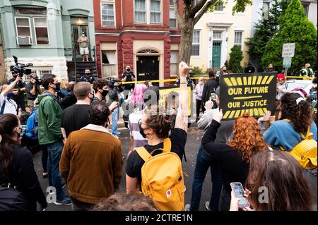 Protesters gather outside the Washington, DC home of Mitch McConnell as they take part during the demonstration.Protest demanding the American people to decide who nominates the next Supreme Court Justice. The demonstration took place outside of the Washington, DC home of Mitch McConnelland it was organized by Sunrise DC, Long Live Go and Shutdown DC. Stock Photo