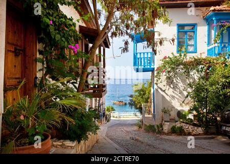 The small balcony covered streets of Kalkan in Turkey.  Kalkan is a popular holiday destination and is located on the Turkish Mediterranean coast.  - Stock Photo
