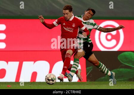 Lisbon, Portugal. 24th Sep, 2020. Scott Wright of Aberdeen FC (L) vies with Pedro Porro of Sporting CP during the UEFA Europa League third qualifying round football match between Sporting CP and Aberdeen FC at Jose Alvalade stadium in Lisbon, Portugal, on September 24, 2020. Credit: Pedro Fiuza/ZUMA Wire/Alamy Live News Stock Photo