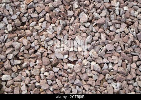 A closeup of gravel and pebbles used to avoid puddles on the sandy soils occupy the image Stock Photo