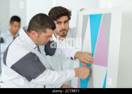 young apprentice painter in professional training Stock Photo
