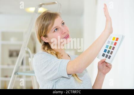 woman designer choosing interior design color from swatch palette Stock Photo