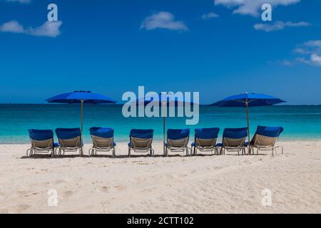 View of Cabbage beach in Paradise Island with sunbeds and umbrellas (Nassau, Bahamas). Stock Photo