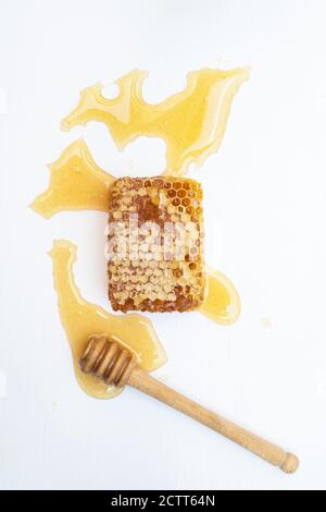 Honeycomb with a drizzler on a white background Stock Photo