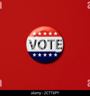 Vote badge on red background Stock Photo