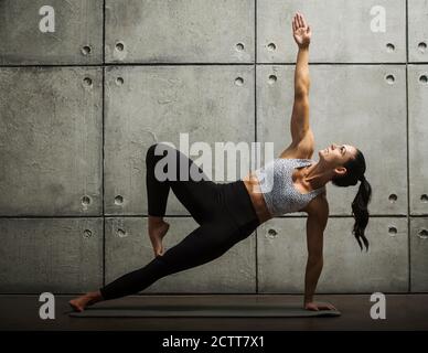 Woman doing yoga pose Stock Photo