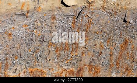 abstract grunge and cracking texture with paint flaking on rusty metal background Stock Photo