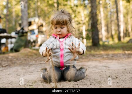 Girl (2-3) playing in sand, Wasatch Cache National Forest Stock Photo