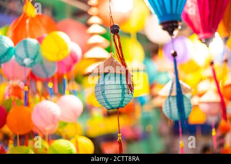 Decorated colorful lanterns hanging on a stand in the streets of Cholon in Ho Chi Minh City, Vietnam during Mid Autumn Festival. Chinese language in p Stock Photo