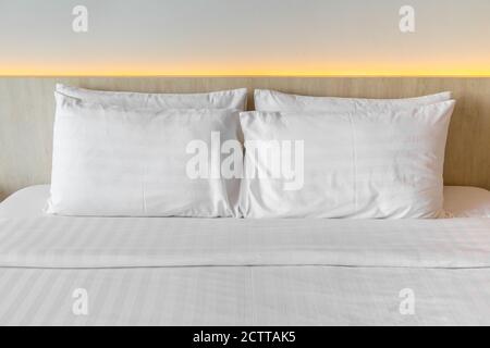 White pillows on a bed Comfortable soft pillows on the bed Stock Photo