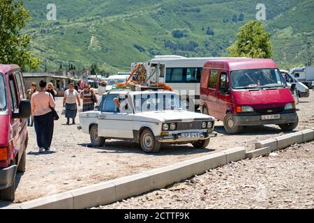 Gori, Georgia - June 13 2017: washing machine placed on an old and rusty VAZ 2106 Zhiguli Soviet car roof rack , a traditional form of transportation Stock Photo