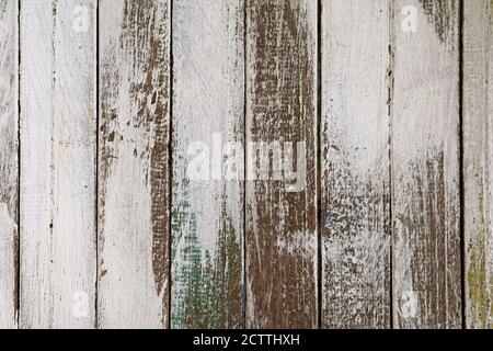 Old grunge colored vertical pattern wooden fence Stock Photo