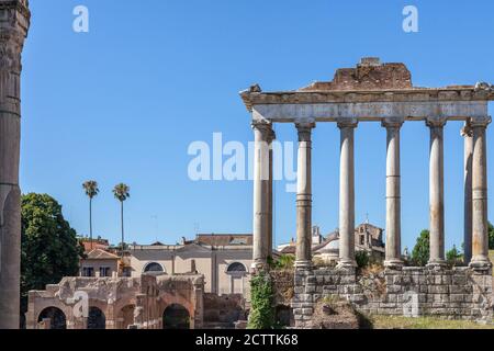 ROME, ITALY - 2014 AUGUST 18. Roman ruins with cityscape of Rome. Stock Photo