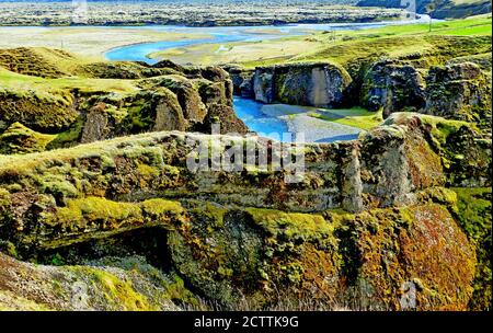 Beautiful Fjadrargljufur Canyon, Iceland. Fjadra River. Wonderful icelandic landscape. Green mossy cliffs. Picturesque gorge has steep walls. Summer. Stock Photo