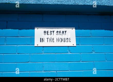 'best seat in the house' sign on the wall of the Murwillumbah youth hostel Stock Photo