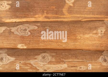 Closeup of three tree trunks of a log house lying on top of each other Stock Photo