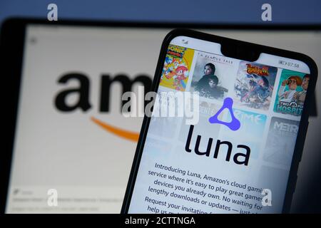 Amazon Luna cloud gaming login page seen on the screen of smartphone and blurred Amazon logo on the back. Luna Plus is a subscription based new gaming Stock Photo