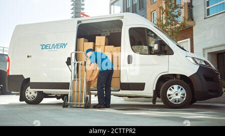 Courier Takes out Cardboard Box Package From Opened Delivery Van Side Door. Professional Courier Loader helping you Move, Delivering Your Purchased