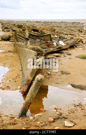 Remains of ship (after shipwreck) at Hunstanton beach, Norfolk, UK. Stock Photo