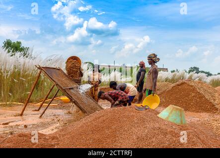 Durgapur/ India-September 24, 2020.  Local Male workers with a Female worker, working on a construction site. Selective Focus is used. Stock Photo