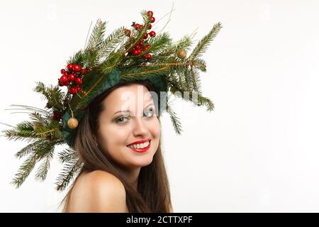 Beautiful smiling woman with winter decoration crown. Christmas and holiday Stock Photo