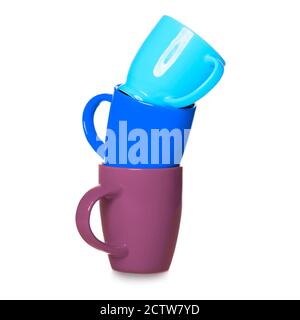 Stack of three motley cups isolated on white background. Three coffee mugs - blue, light blue and purple Stock Photo