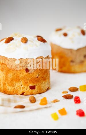 Easter composition. Easter cake decorated with almond petals on a white background Stock Photo