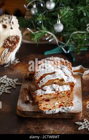 Stollen is fruit bread of nuts, spices, dried or candied fruit, coated with powdered sugar. It is traditional German bread eaten during the Christmas Stock Photo