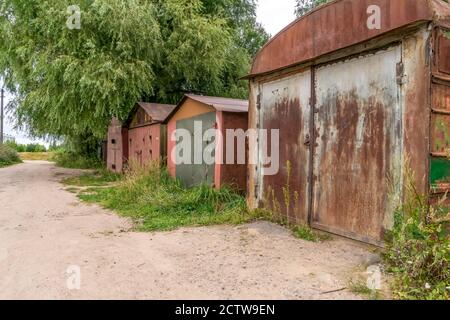 Old rusty garages on a summer day Stock Photo