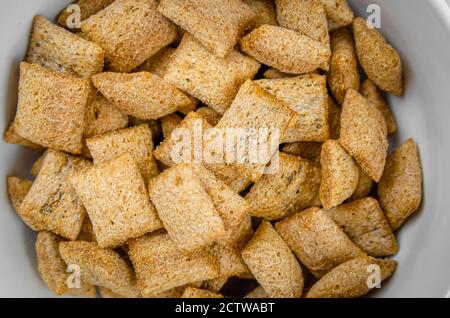 Bowl with sweet corn pads with chocolate inside close-up, top view Stock Photo