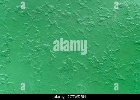 Texture of a green wall with cracks, scratches. Background Stock Photo