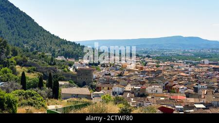 Panoramic image residential buildings typical spanish village, view from above to hillside houses of Xativa town. Valencian Community. Spain Stock Photo