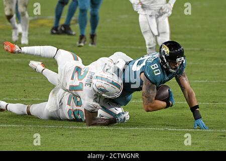 Jacksonville, United States. 24th Sep, 2020. Tight End James O'Shaughnessy (80) is tackled following a reception in the fourth quarter as the Miami Dolphins compete against the Jacksonville Jaguars at the TIAA Bank Field in Jacksonville, Florida on Thursday, September 24, 2020. The Dolphins defeated the Jaguars 31 to 13. Photo by Joe Marino/UPI Credit: UPI/Alamy Live News Stock Photo